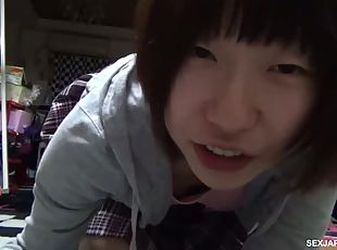 Hairy Asian teen Hana fingers her tight pussy.