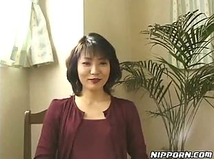 Perverted Japanese milf spreads pantyhose legs and shows off her snatch